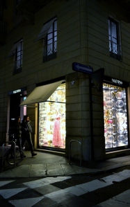 Nadia Mikushova. A Valentino boutique in Milan by night.